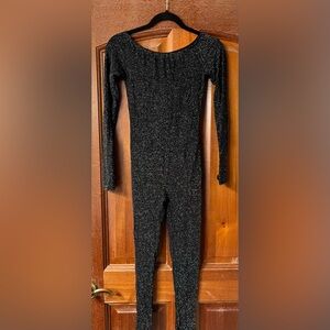 Poster-Girl for Dolls Kill sparkle black jumpsuit